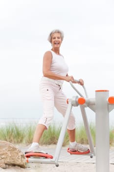 Active senior woman on the beach