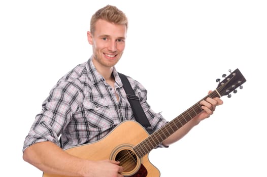 Studio shot of a young man with a guitar