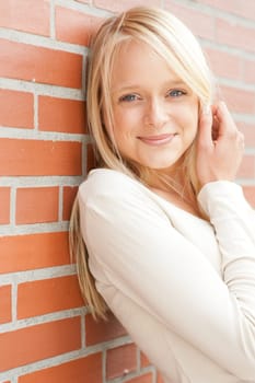 Portrait of a young and smiling woman in the park
