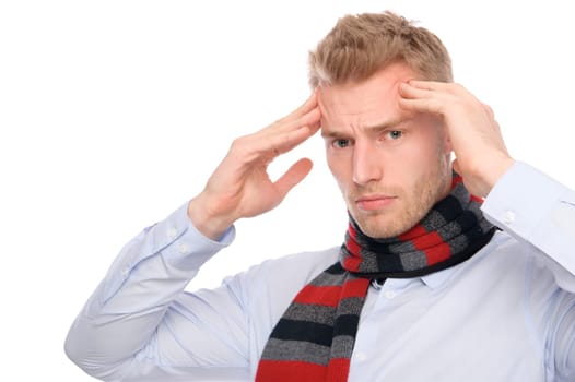 Studio shot of a young man with a headache