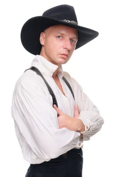 Man in western outfit against white background in studio