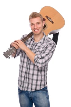 Studio shot of a young man with a guitar