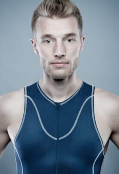 Portrait of a sportsman against a blue background