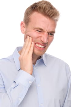 Studio shot of a young man with a headache