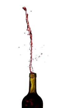 Red wine being poured directly upwards from bottle