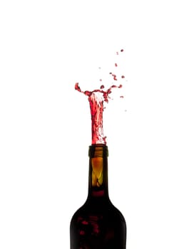 Red wine being poured directly upwards from bottle