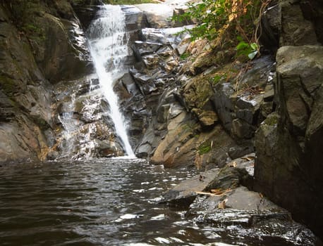 Amazing waterfall in the wet green rainforest.