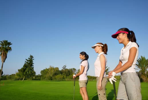Golf three woman in a row green grass course players