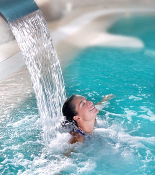 spa hydrotherapy woman waterfall jet turquoise swimming pool water