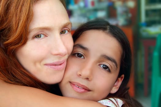 multiracial american mother and daughter family hug
