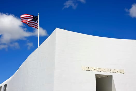 USS Arizona Memorial with American flag waving