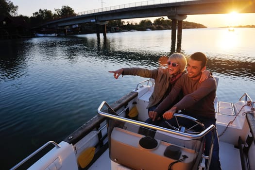 happy young couple in love  have romantic time at summer sunset   at ship boat while  representing urban and countryside fashin lifestyle