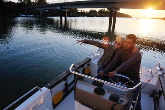 happy young couple in love  have romantic time at summer sunset   at ship boat while  representing urban and countryside fashin lifestyle