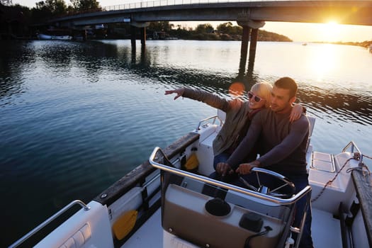 happy young couple in love  have romantic time at summer sunset   at ship boat while  representing urban and countryside fashin lifestyle