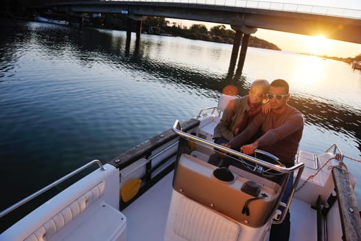 happy young couple in love  have romantic time at summer sunset   at ship boat while  representing urban and countryside fashin lifestyle