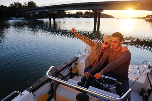 happy young couple in love  have romantic time at summer sunset   at ship boat while  representing urban and countryside fashin lifestyle