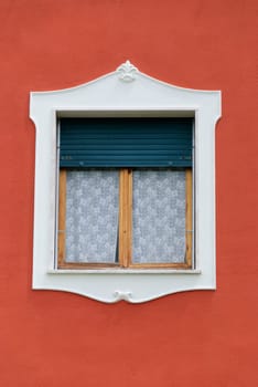window decoration and orange wall