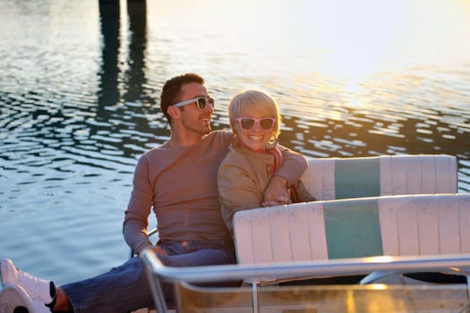happy young couple in love  have romantic time at summer sunset   at ship boat while  representing urban and countryside fashin lifestyle