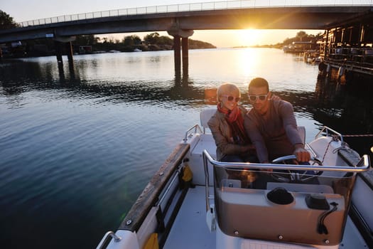 happy young couple in love  have romantic time at summer sunset   at ship boat while  representing urban and countryside fashin lifestyle