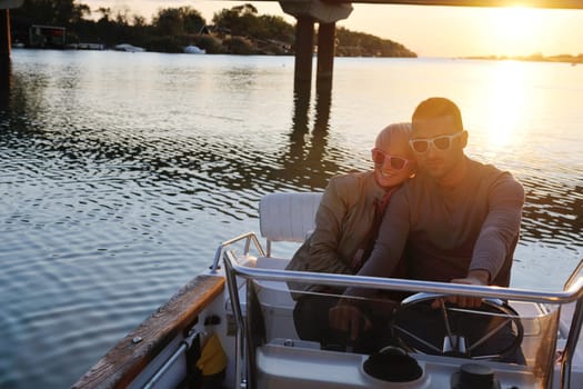 happy young couple in love  have romantic time at summer sunset   at ship boat while  representing urban and countryside fashin lifestyle