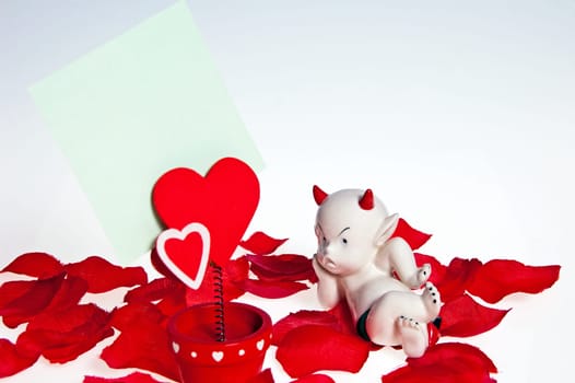 composition on valentines day with the devil and the heart-shaped flower