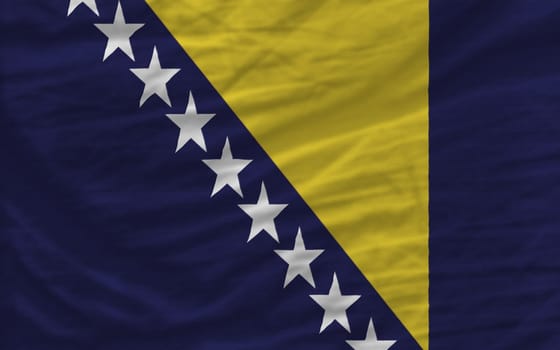 complete national flag of bosnia herzegovina covers whole frame, waved, crunched and very natural looking. It is perfect for background