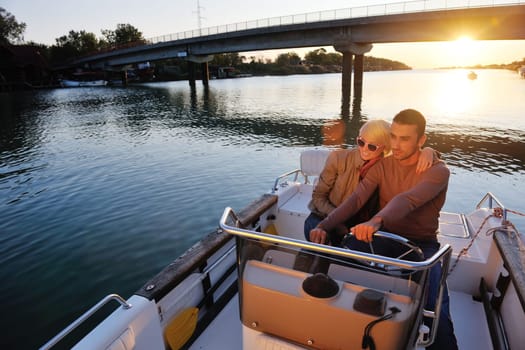 happy young couple in love  have romantic time at summer sunset   at ship boat while  representing urban and countryside fashin lifestyle
