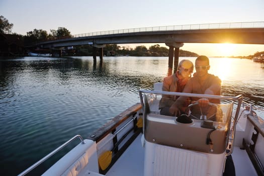 happy young couple in love  have romantic time at summer sunset   at ship boat while  representing urban and countryside fashin lifestyle