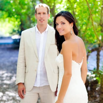 bride just married couple in love at outdoor green park