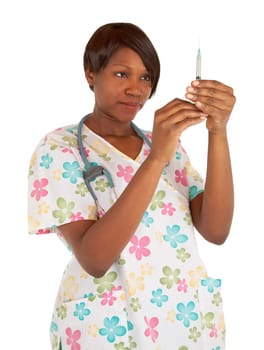 An african american nurse is checking the dosage in a syringe.