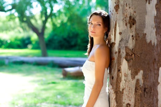 bride woman happy posing in outdoor tree park
