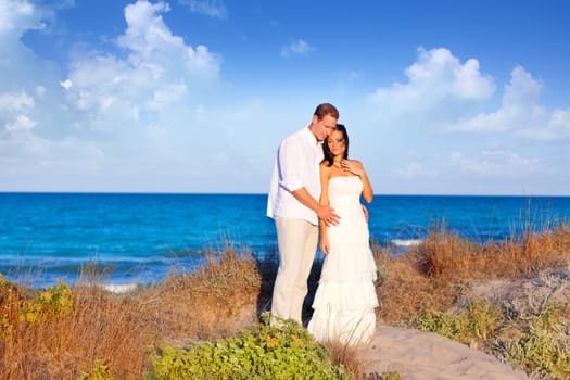 couple in love in the beach dune on Mediterranean sea