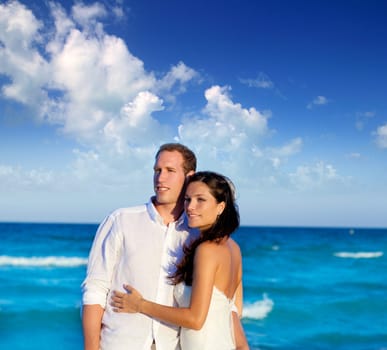couple in love hug in blue sea vacation in Spain