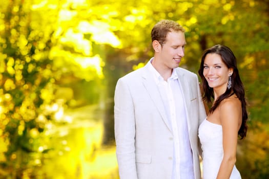 just married couple in honeymoon autumn park