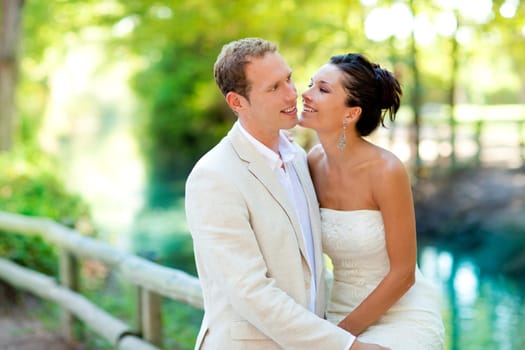 couple of lovers in love in park river outdoors hug