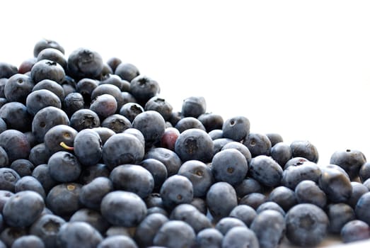 pile of blueberries isolated on white background