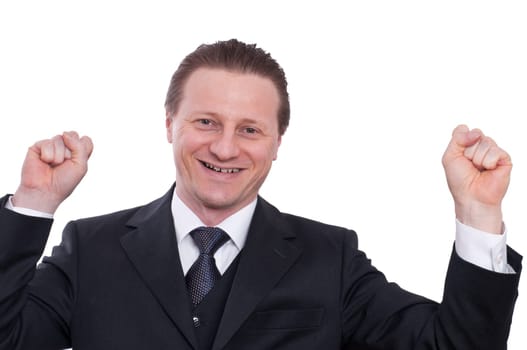 A man in a suit with a tie cheers