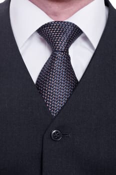 Close-up of a tie with shirt and vest