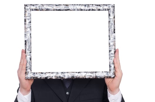 A wooden frame is held by two hands
