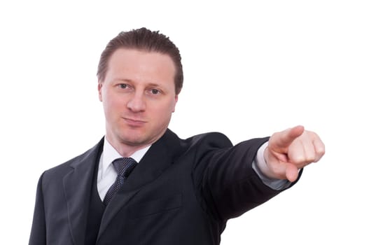 A man in a tie and suit points his index finger forward