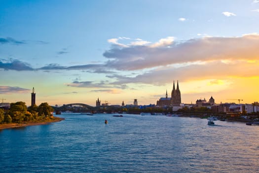 sunset in cologne with Dome and river Rhine