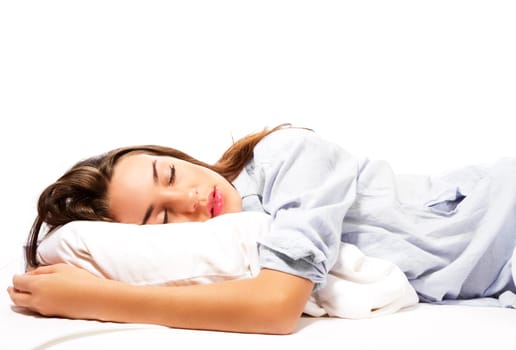 Sleeping beautiful woman in pajamas against white background