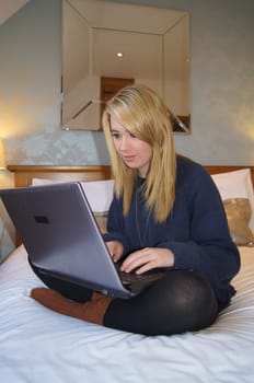 Girl Communicating with her Friends on her Laptop