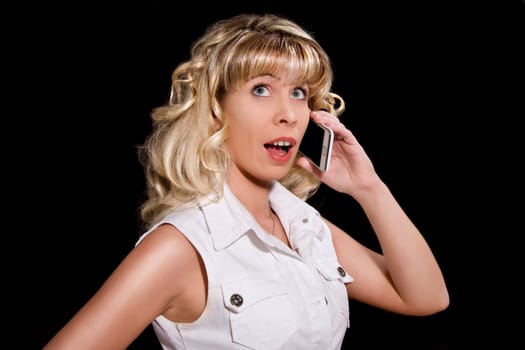 Young woman with mobile phone Looks frightened