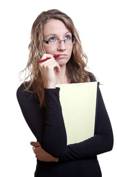 Young student with a pen and notebook thinking