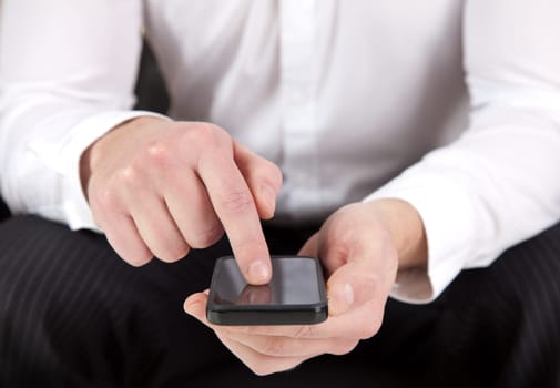 Hands of a man using a smartphone