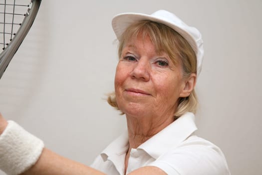 Senior woman playing tennis