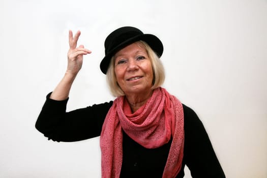 Portrait of a senior woman with a hat