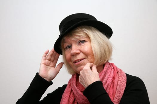 Portrait of a senior woman with a hat