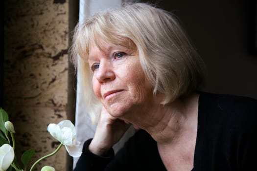 Senior woman at the window